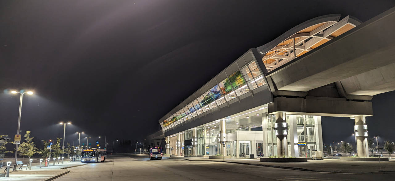 Image of the Davies LRT station on Edmonton's Valley Line Southeast LRT line, showing the elevated LRT station and buses beside it in the bus bay.